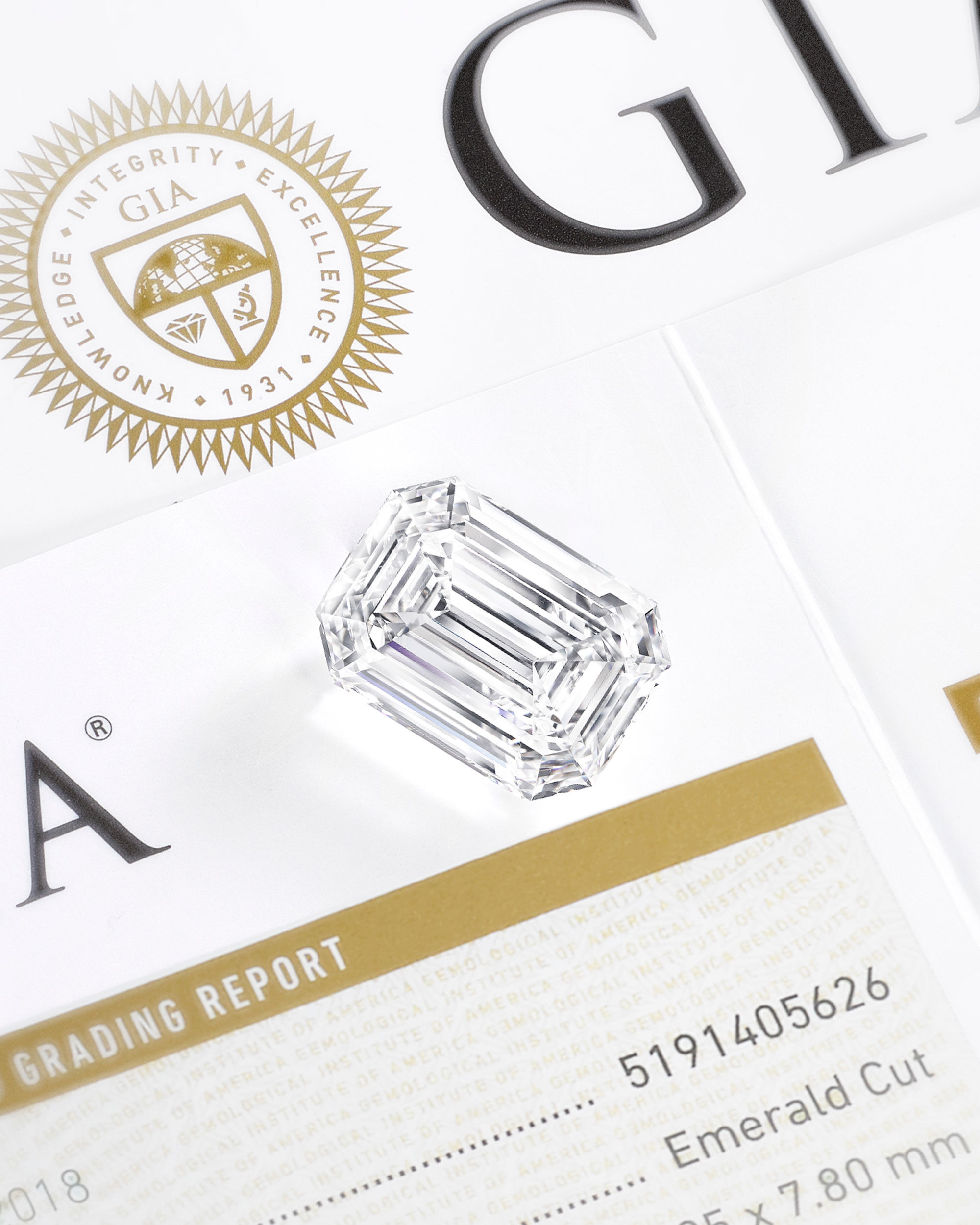 Close up of a Graff emerald cut diamond on a GIA certificate