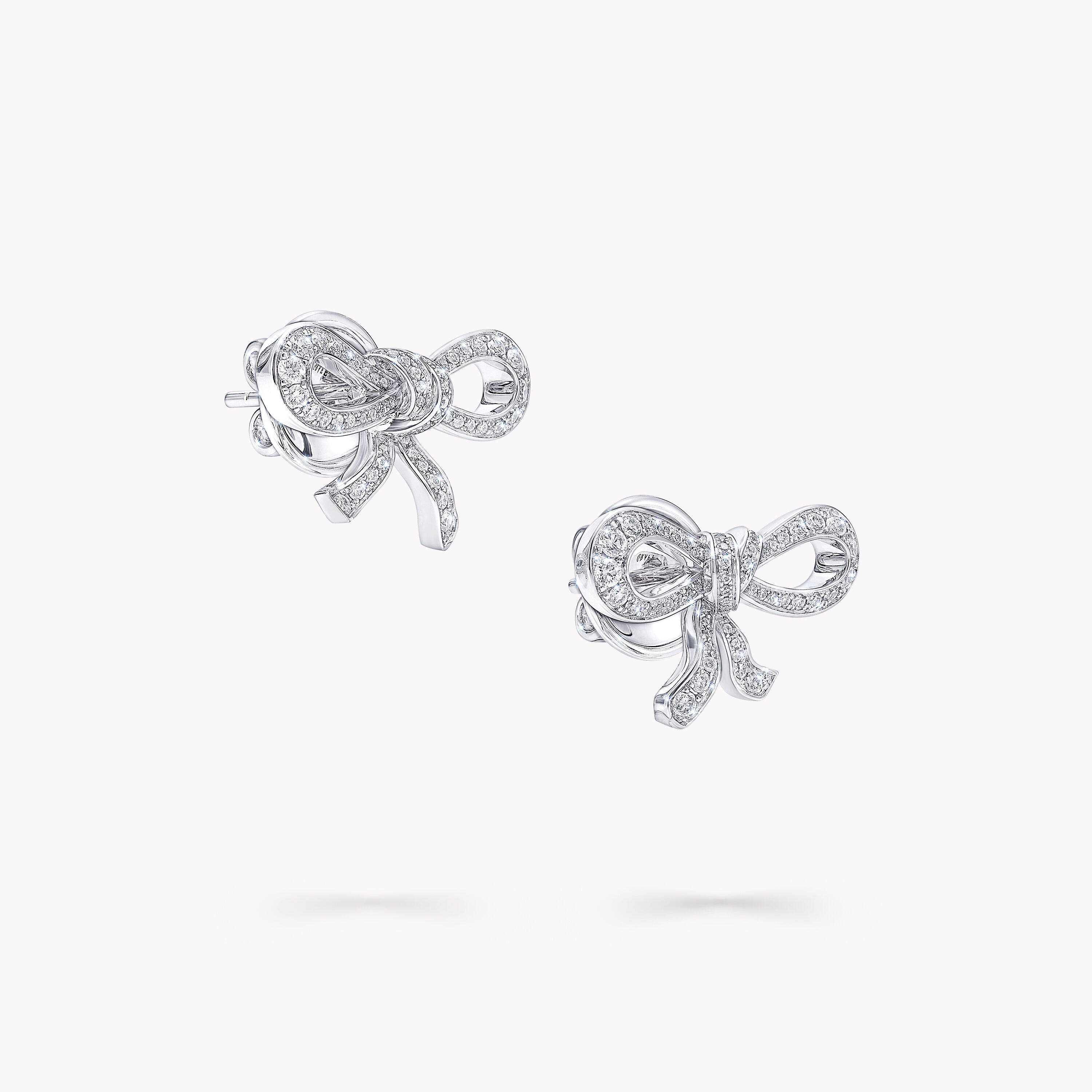 Diamond bow hotsell earrings white gold