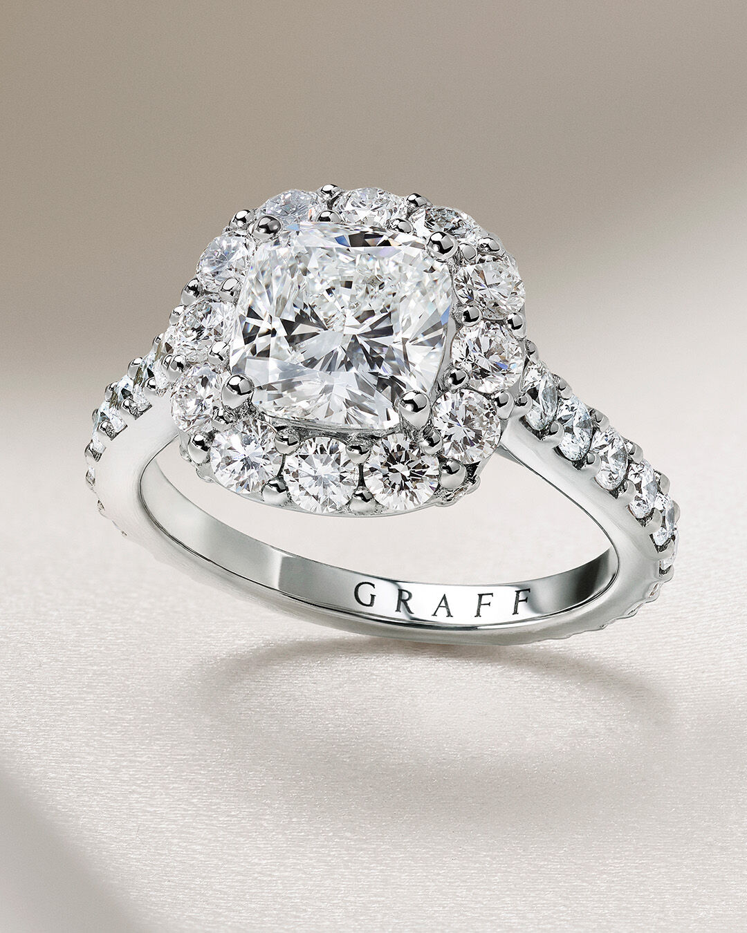 Image shows Graff Oval Diamond engagement ring and Graff round diamond wedding band 