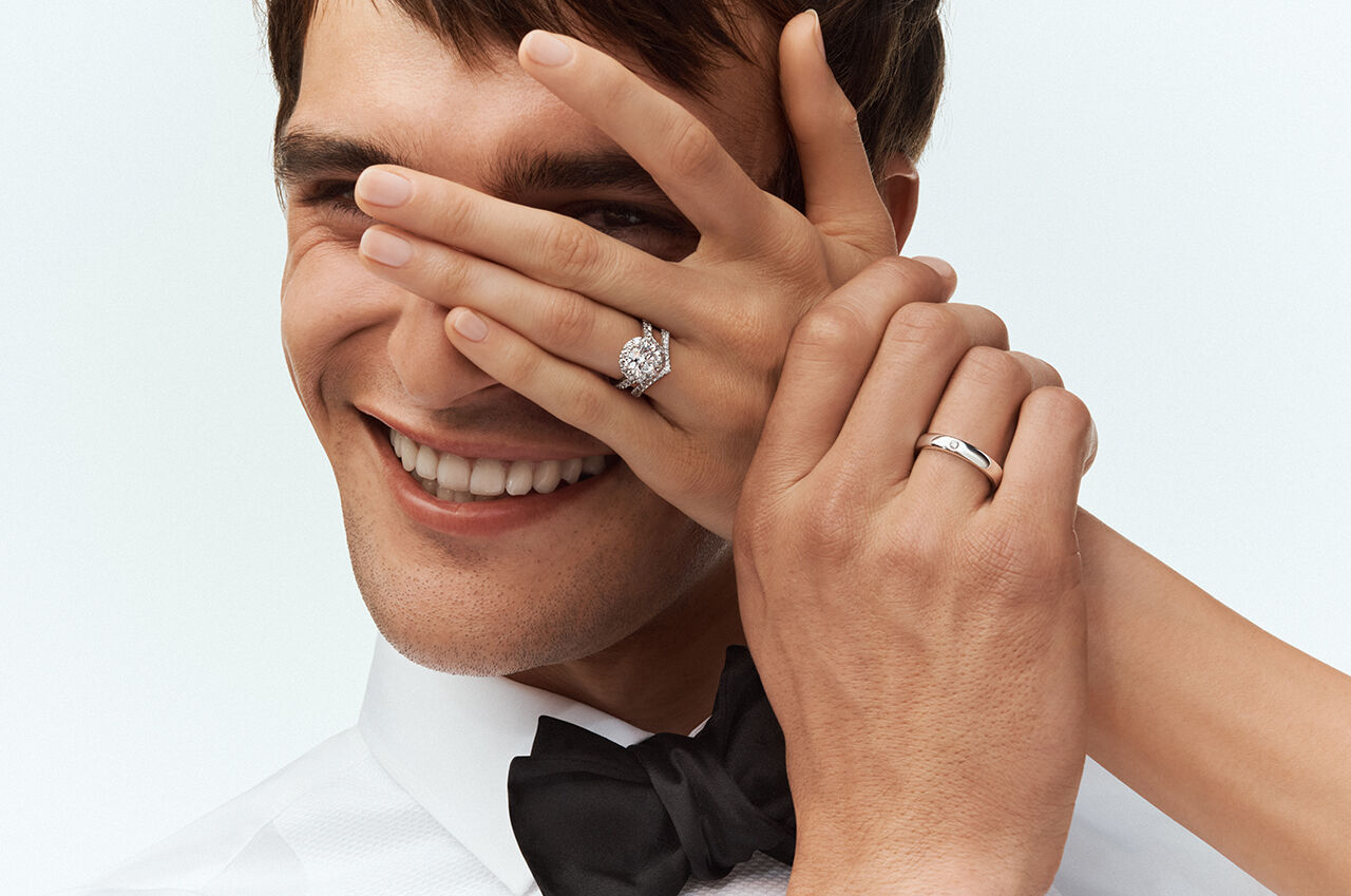 Female and male model wearing Graff Wedding Bands and Engagement Ring