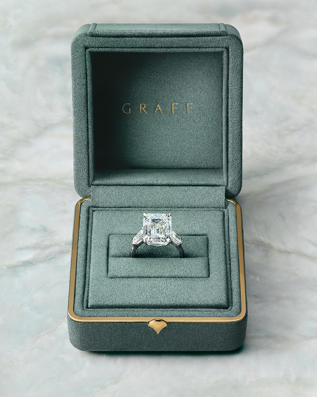Image shows loose Graff Emerald Cut Diamond and tools