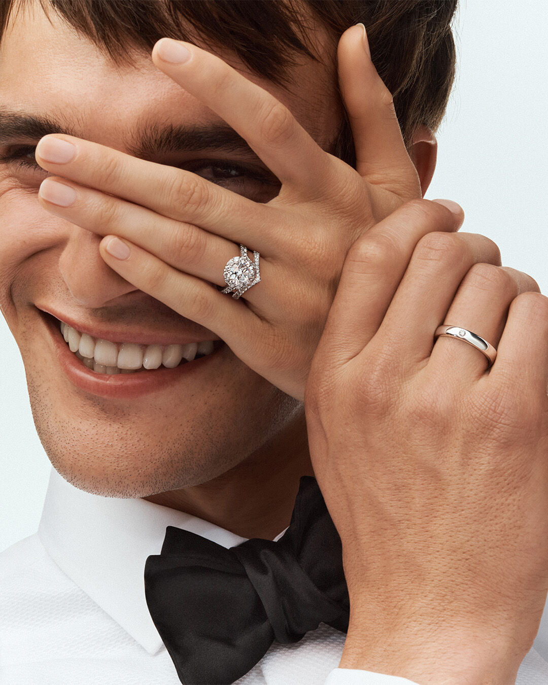 Female and Male model wear Graff Engagement Ring and Wedding Bands