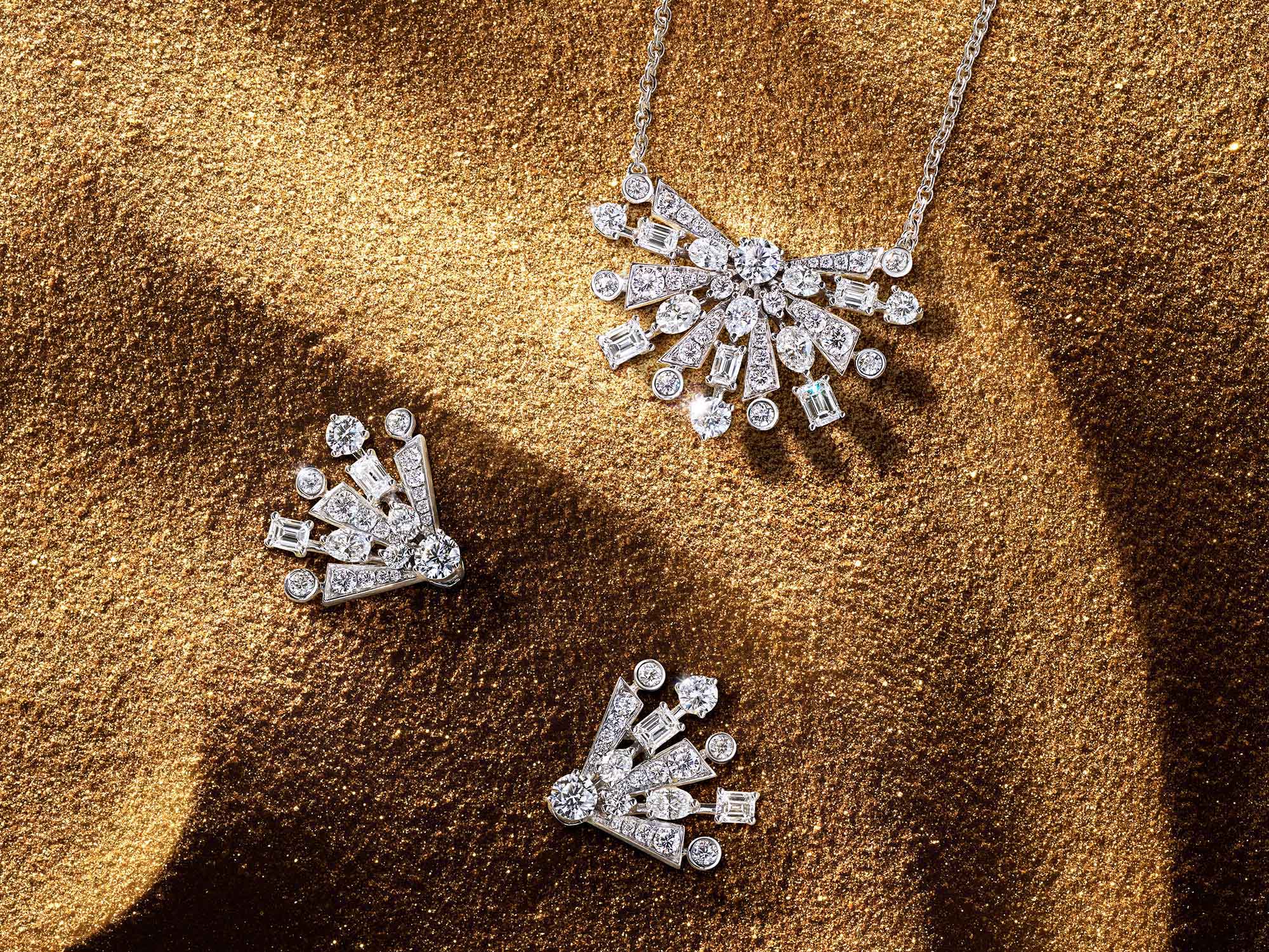 The Graff New Dawn diamond earrings and pendant from the Tribal jewellery collection, on sand