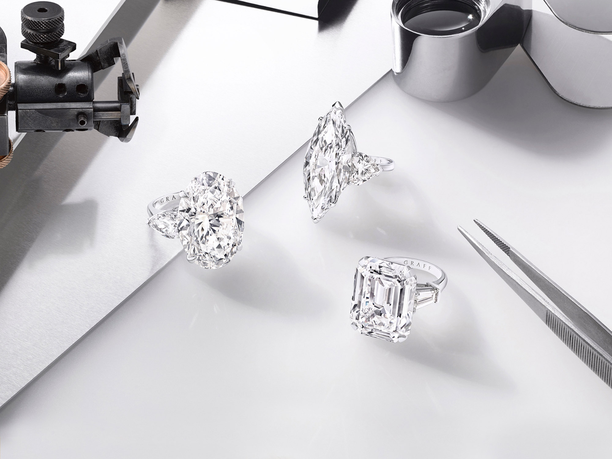 Three Graff Promise engagement rings set with Oval shape diamond, Marquise Shape Diamond and Emerald Cut Diamond.