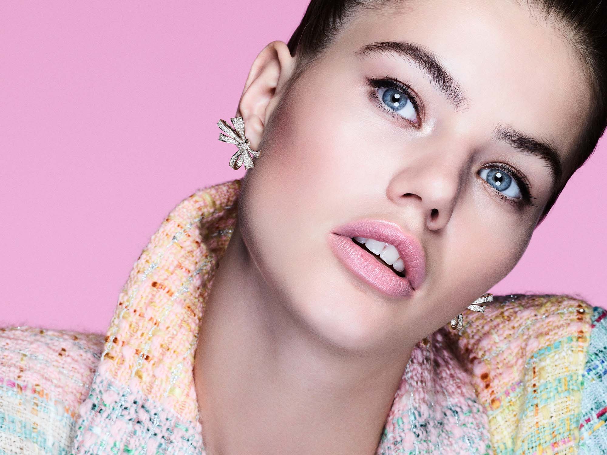 Model wearing Graff Tilda's Bow jewellery collection diamond ring, earrings and necklace