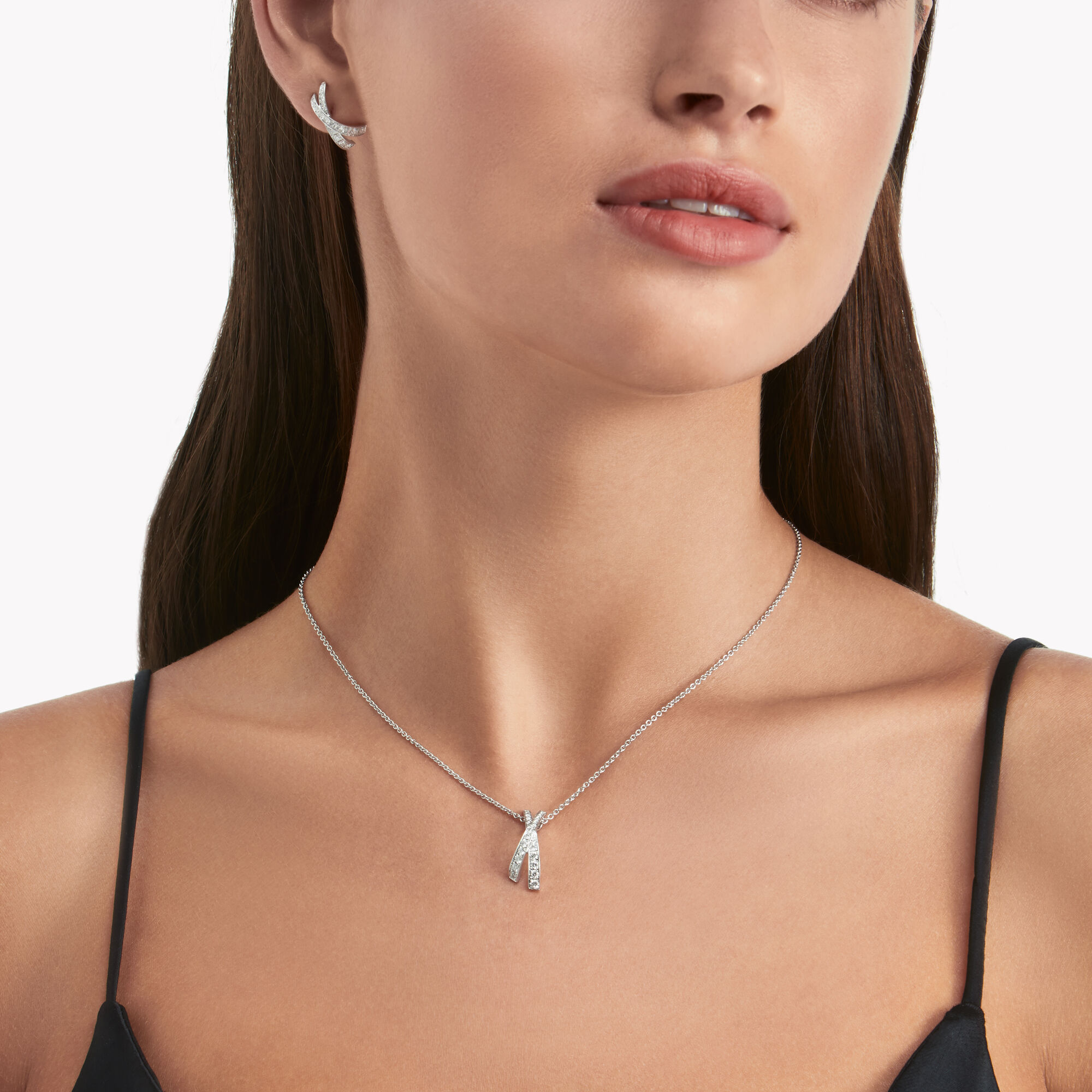 Model wears Kiss Pavé Diamond Stud Earrings and Kiss Pavé Diamond Pendant from the Graff jewellery collection