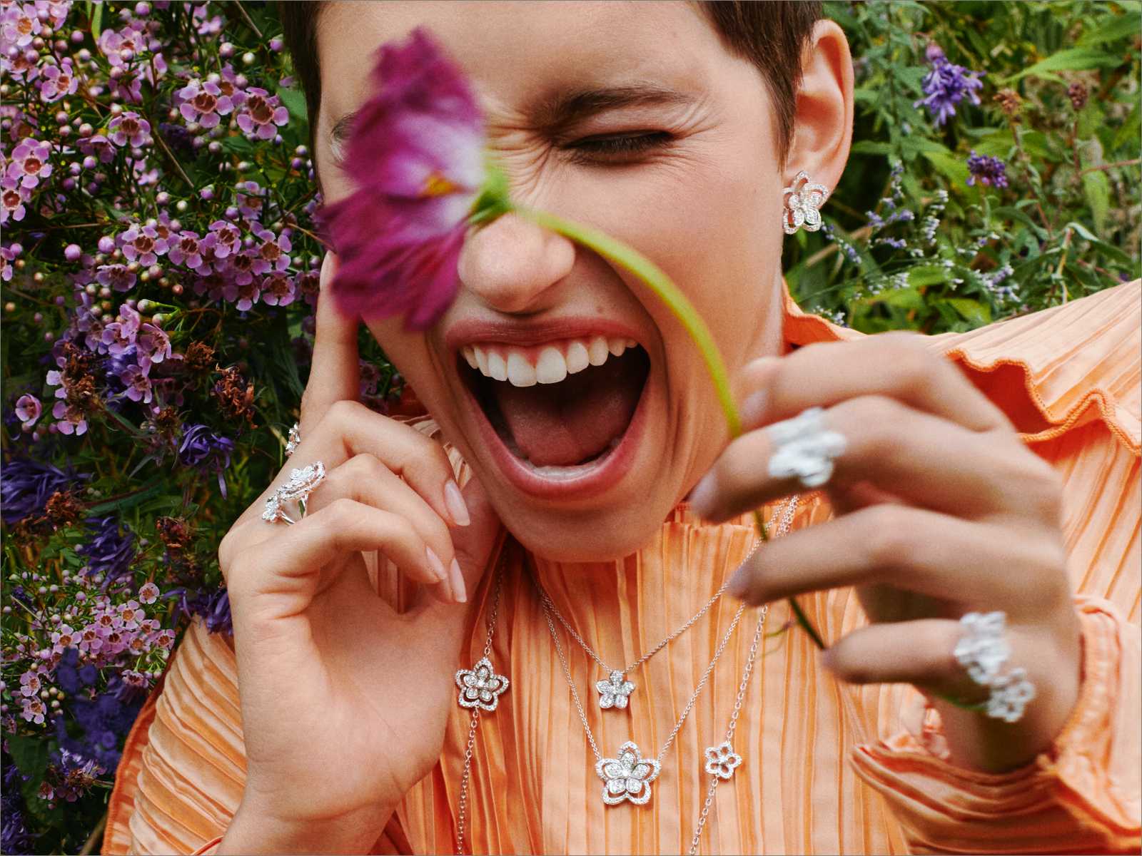 Model wearing Graff Wild Flower jewellery collection diamond rings, necklaces and earrings