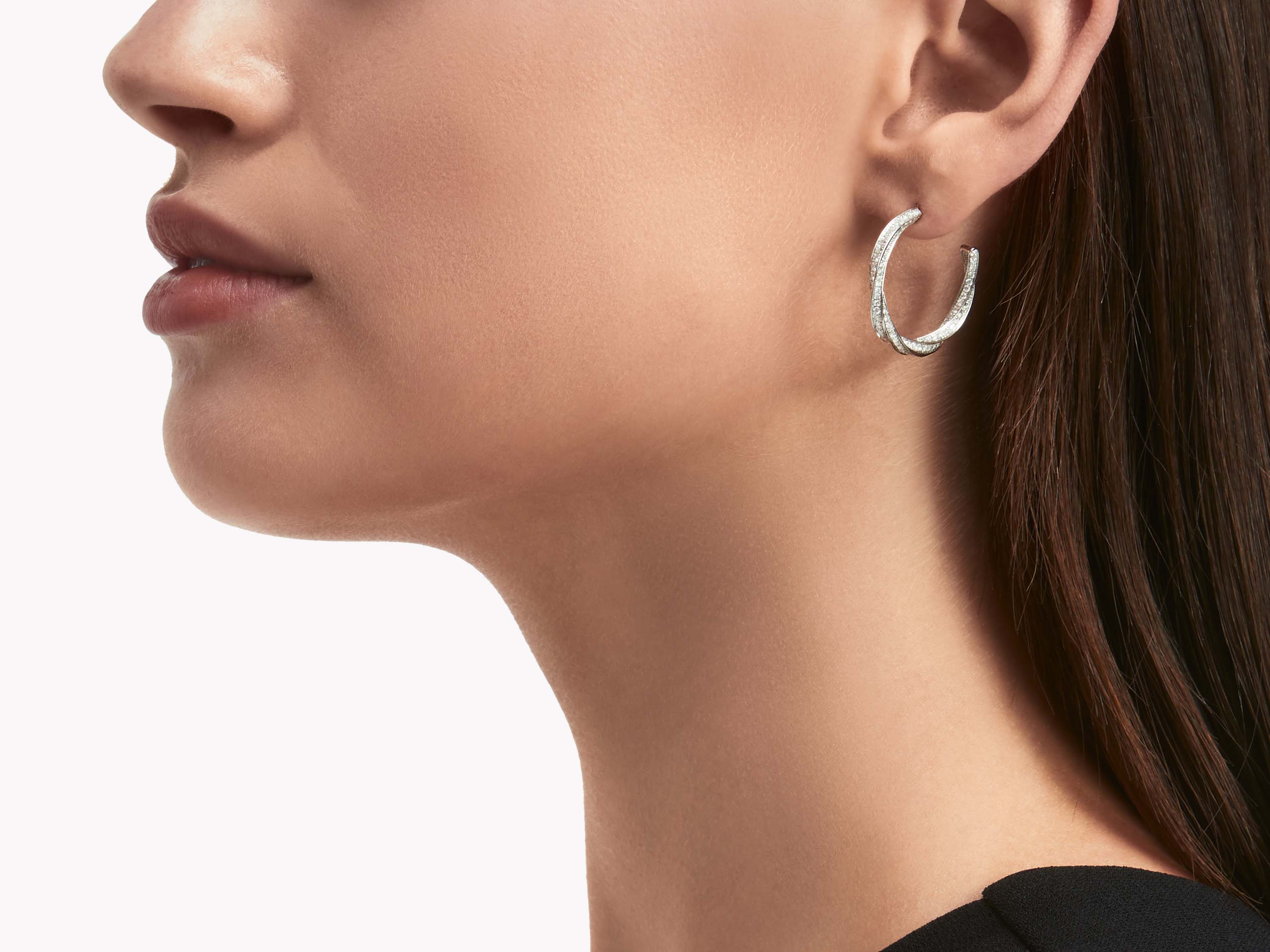 Model wearing Graff Spiral Diamond Hoop Earrings WHITE GOLD