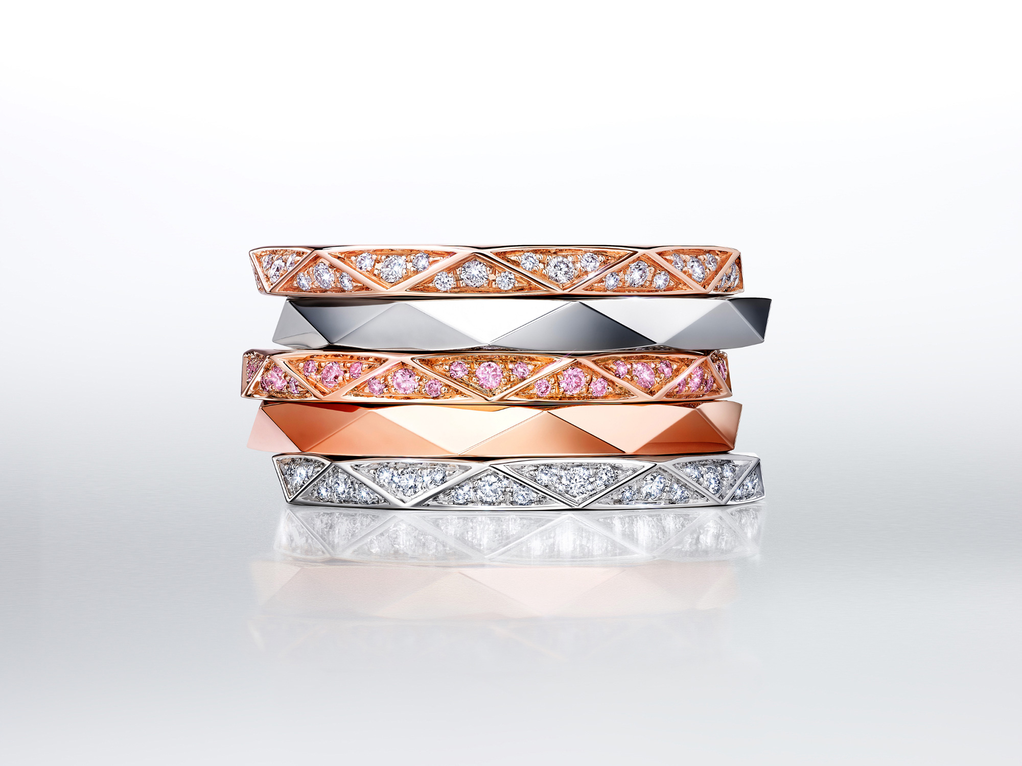 Stacked Laurence Graff signature bands in white Gold and rose gold, set with dIamond paves or plain